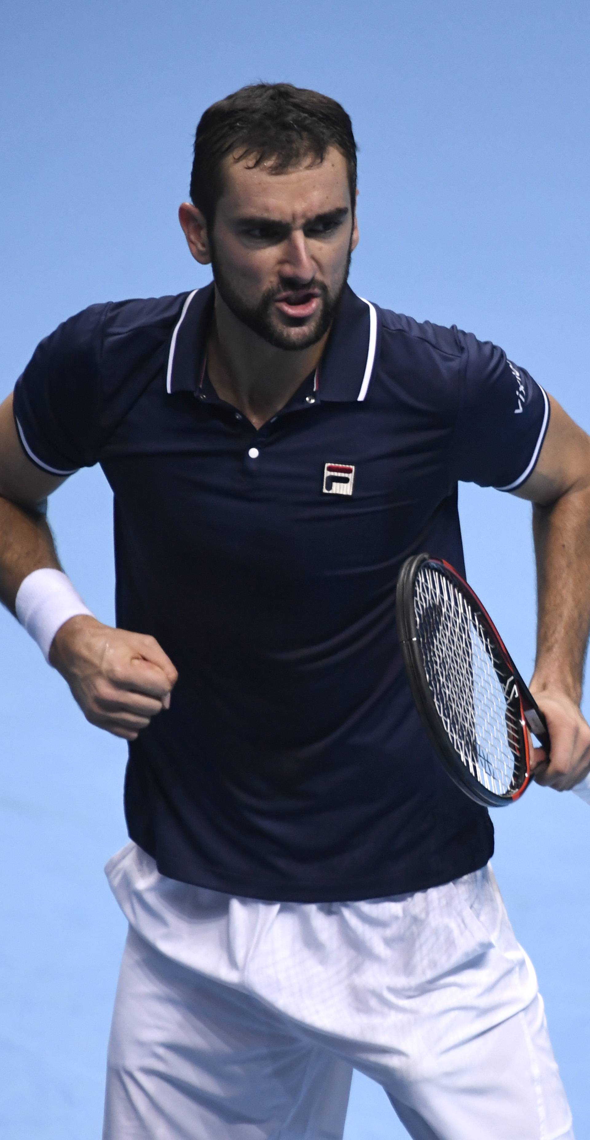 Croatia's Marin Cilic celebrates during his round robin match with Japan's Kei Nishikori