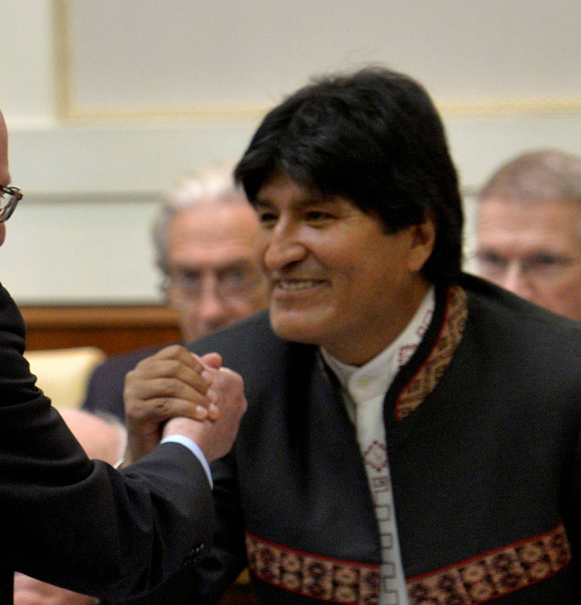 U.S. Democratic presidential candidate Sanders shakes hands with Bolivia's president Morales during a conference at the Vatican