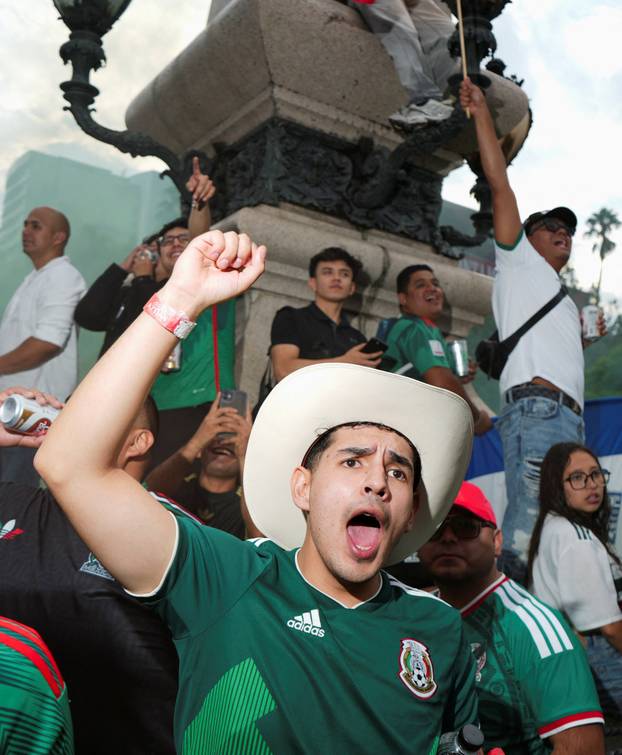 People celebrate Mexico's victory in the opening match of the 2026 FIFA World Cup, in Mexico City