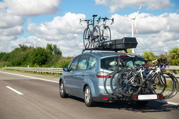 Back,View,Modern,White,Family,Wagon,Car,With,Mounted,Roof