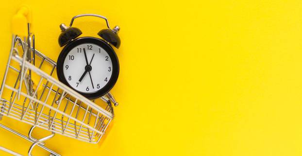 Alarm,Clock,In,Mini,Shopping,Cart,On,Yellow,Background.,Sale,