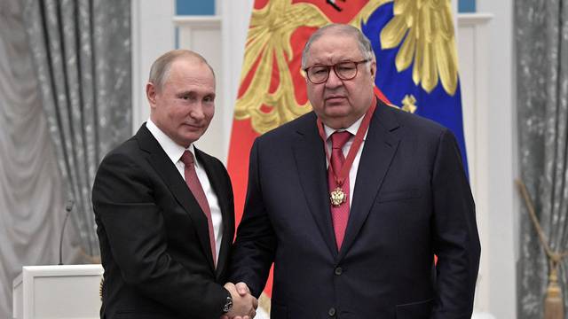 FILE PHOTO: Russian President Putin and Russian businessman Usmanov attend an awarding ceremony in Moscow