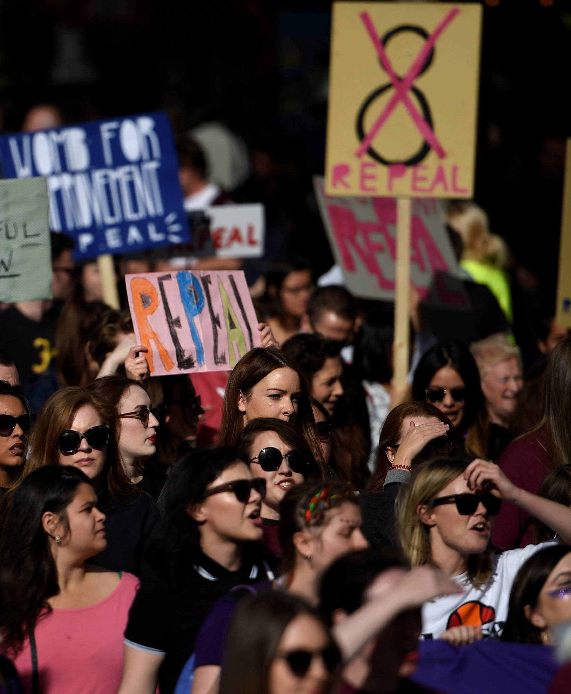 Demonstrators march for more liberal Irish abortion laws, in Dublin