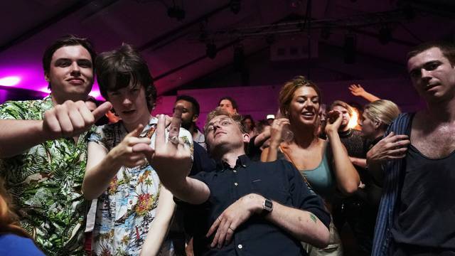 Attendees celebrate during the "00:01" event organised by Egyptian Elbows at Oval Space nightclub, as England lifted most coronavirus disease (COVID-19) restrictions at midnight, in London