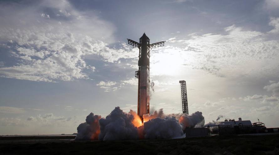 A SpaceX Super Heavy booster carrying the Starship spacecraft lifts off on its 10th test flight