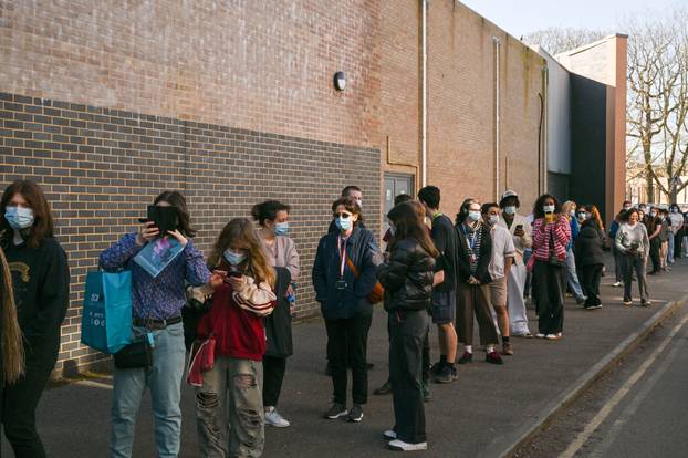 People queue to receive vaccinations at the Sports centre on the University of Kent campus, following an outbreak of meningitis cases in Kent