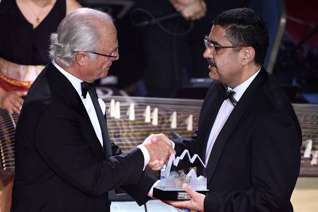 King Carl Gustaf of Sweden gives out the Polar Music Prize to Dr Ahmad Sarmast, founder of Afghanistan National Institute of Music during an award cermony at Grand Hotel in Stockholm