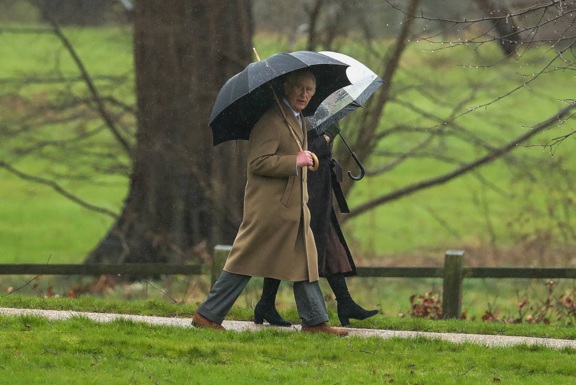 Britain's King Charles and Queen Camilla arrive for a church service at St. Mary Magdalene's church on the Sandringham estate