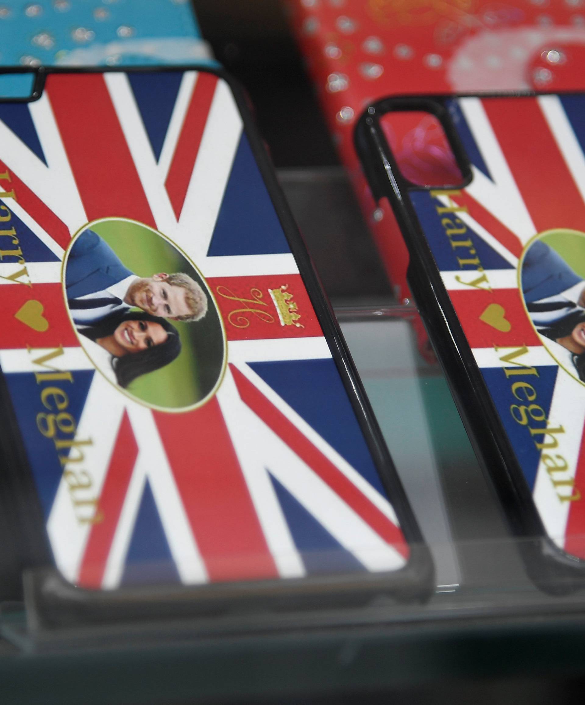 Mobile phone cases commemorating the forthcoming wedding of Britain's Prince Harry and his fiancee Meghan Markle are seen for sale in a shop in Windsor, Britain