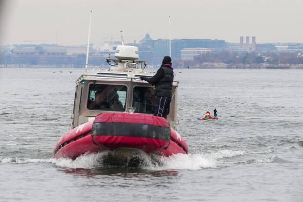 "Waterskiing Santa" skis along the Old Town Alexandria Waterfront in Virginia