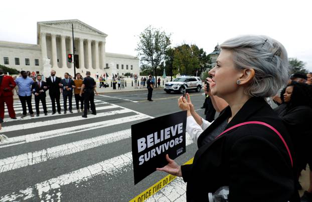 Protestors chant and are arrested demonstrating against the confirmation of U.S. Supreme Court nominee Kavanaugh in front of the  Supreme Court building on Capitol Hill in Washington