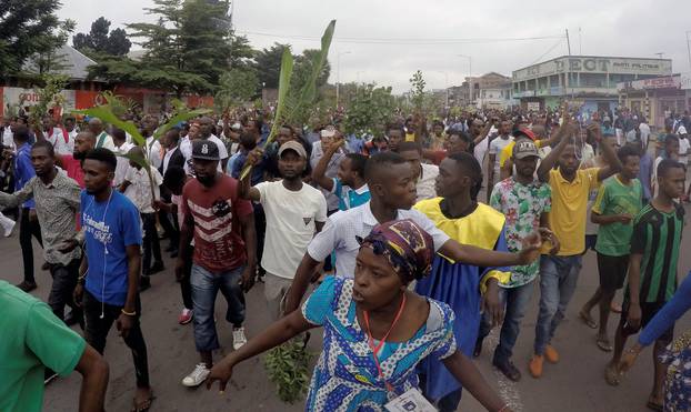 Demonstrators chant slogans during a protest against President Joseph Kabila organized by the Catholic church in Kinshasa