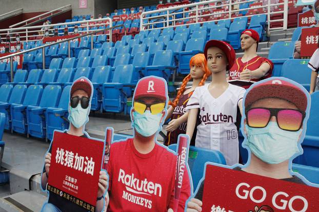 Dummies replaced audience due to the outbreak of the coronavirus disease (COVID-19) at the first of the professional baseball league game at Taoyuan International baseball stadium in Taoyuan city