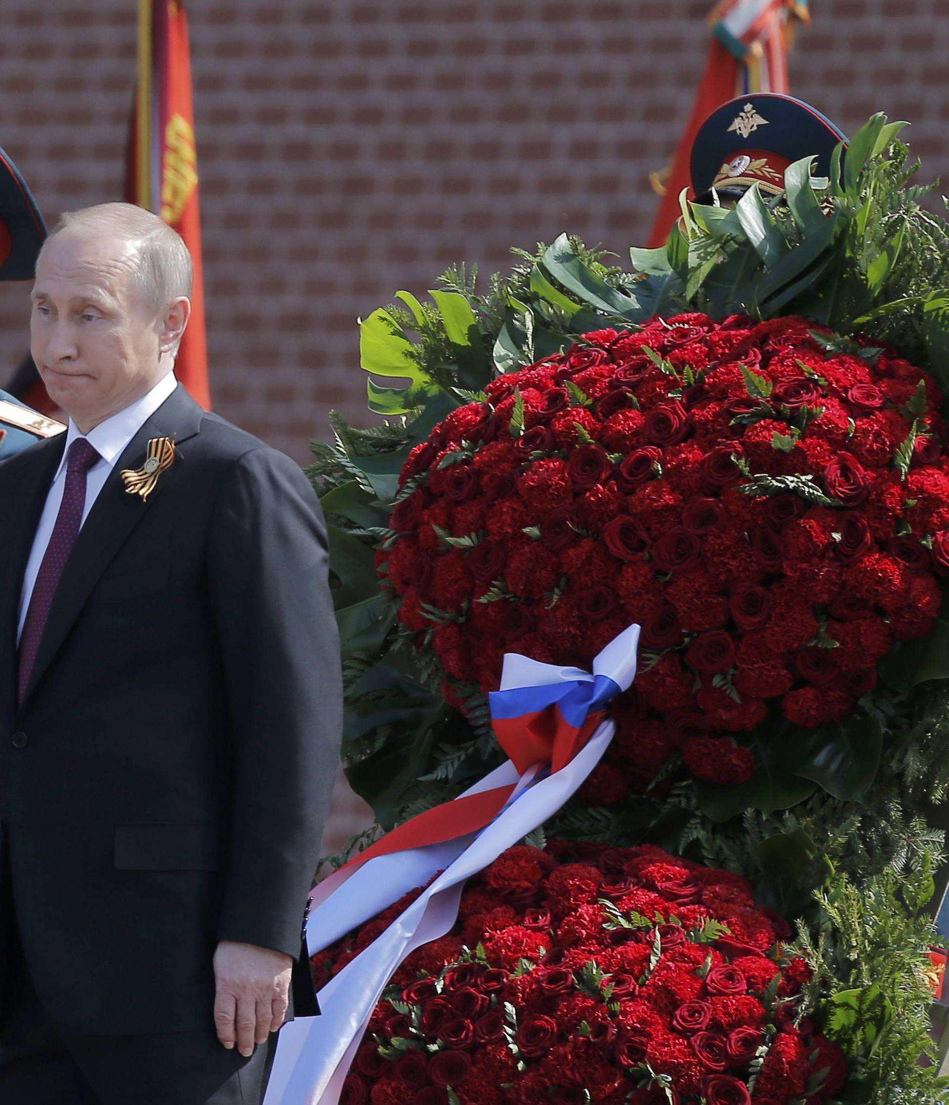 Russian President Putin attends wreath-laying ceremony to mark end of World War Two at Tomb of Unknown Soldier by Kremlin walls in Moscow