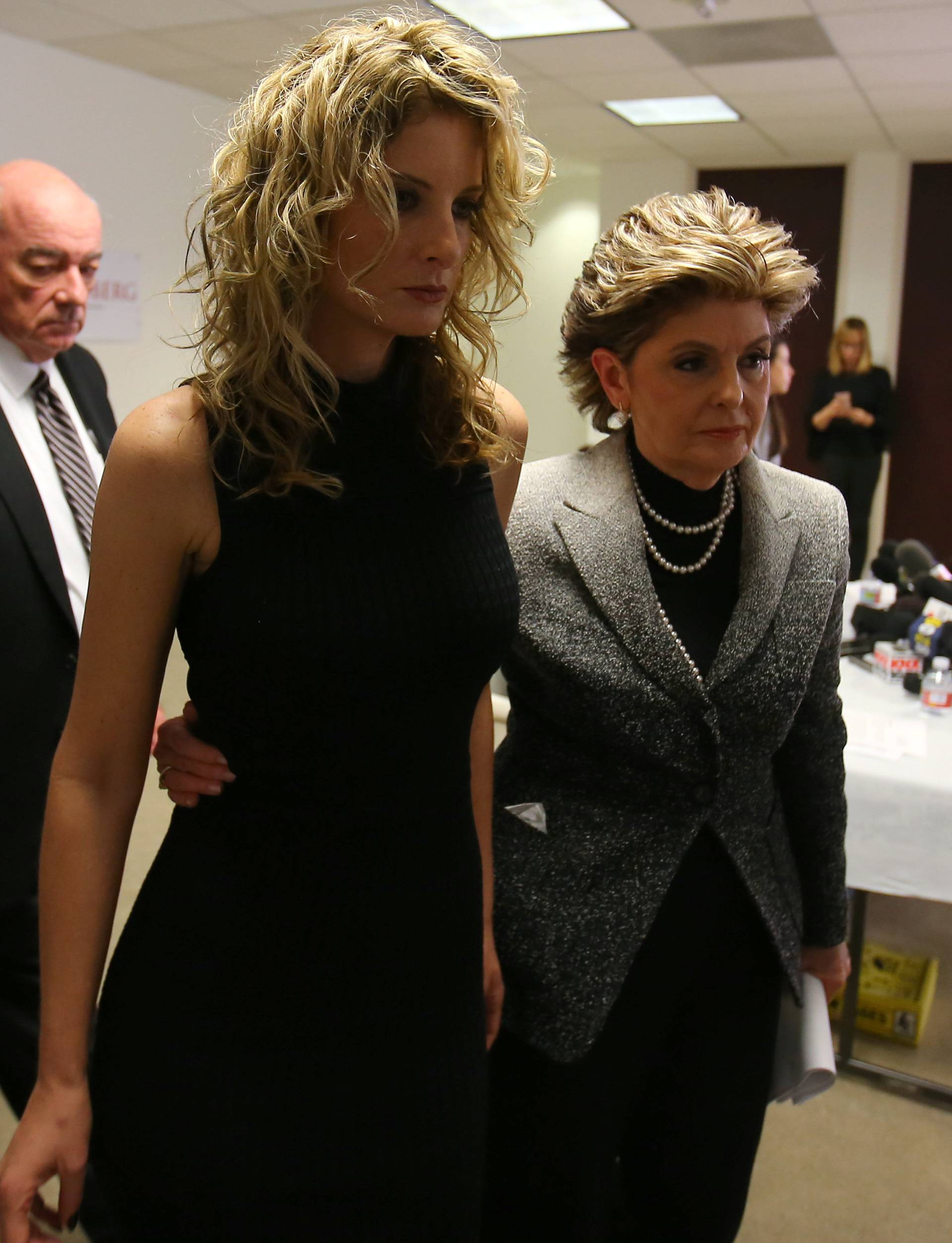 Attorney Gloria Allred leaves with her client Summer Zervos following a news conference announcing the filing of a lawsuit against President-elect Donald Trump in Los Angeles