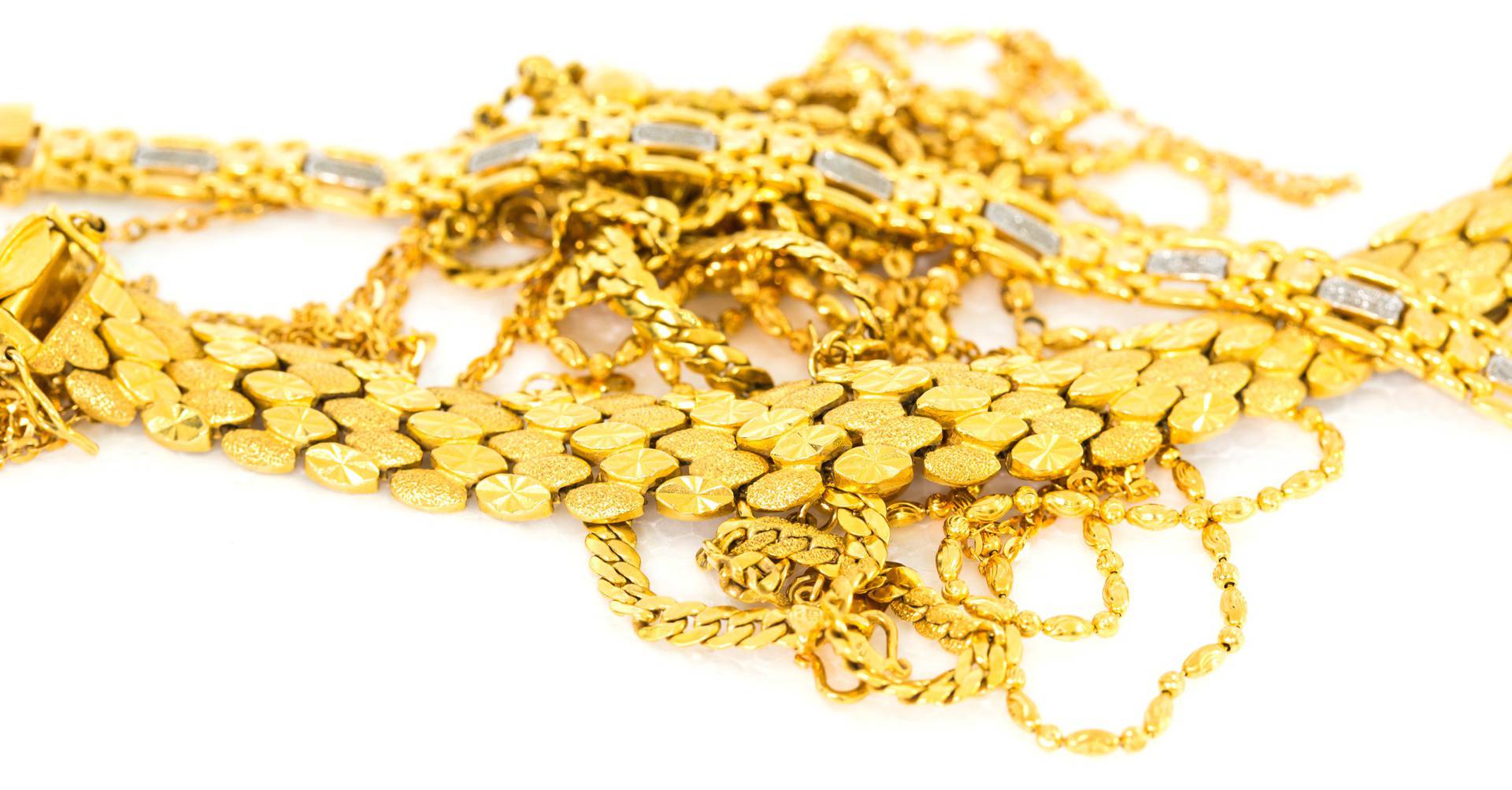 A,Bunch,Of,Gold,Bracelets,And,Necklaces