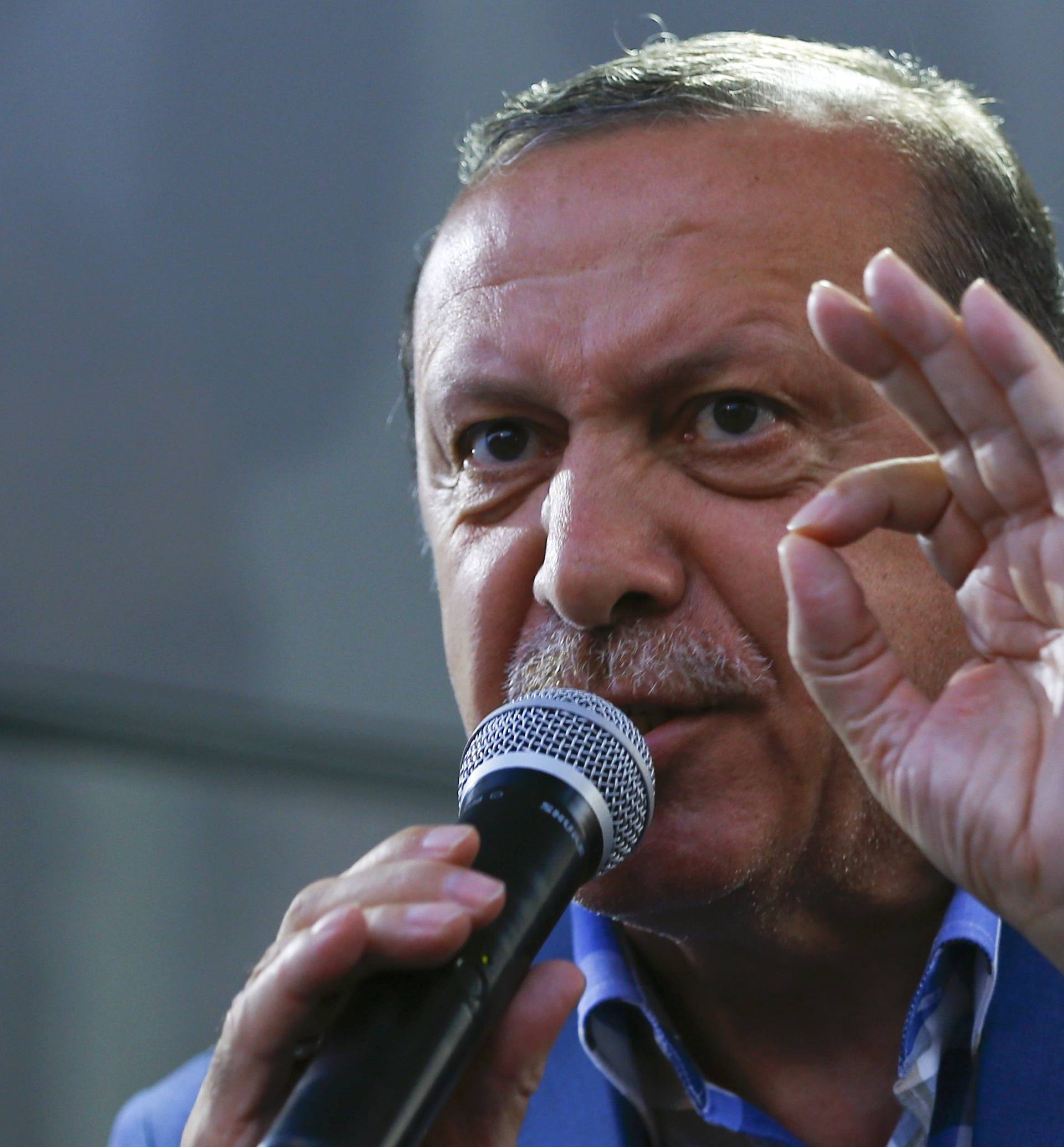 Turkish President Tayyip Erdogan delivers a speech to his supporters in Istanbul