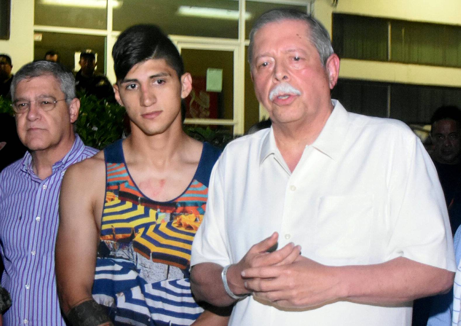 Mexico's striker Alan Pulido is seen next to Tamaulipas State Governor Egidio Torre Cantu after Pulido has been rescued within a day in Ciudad Victoria