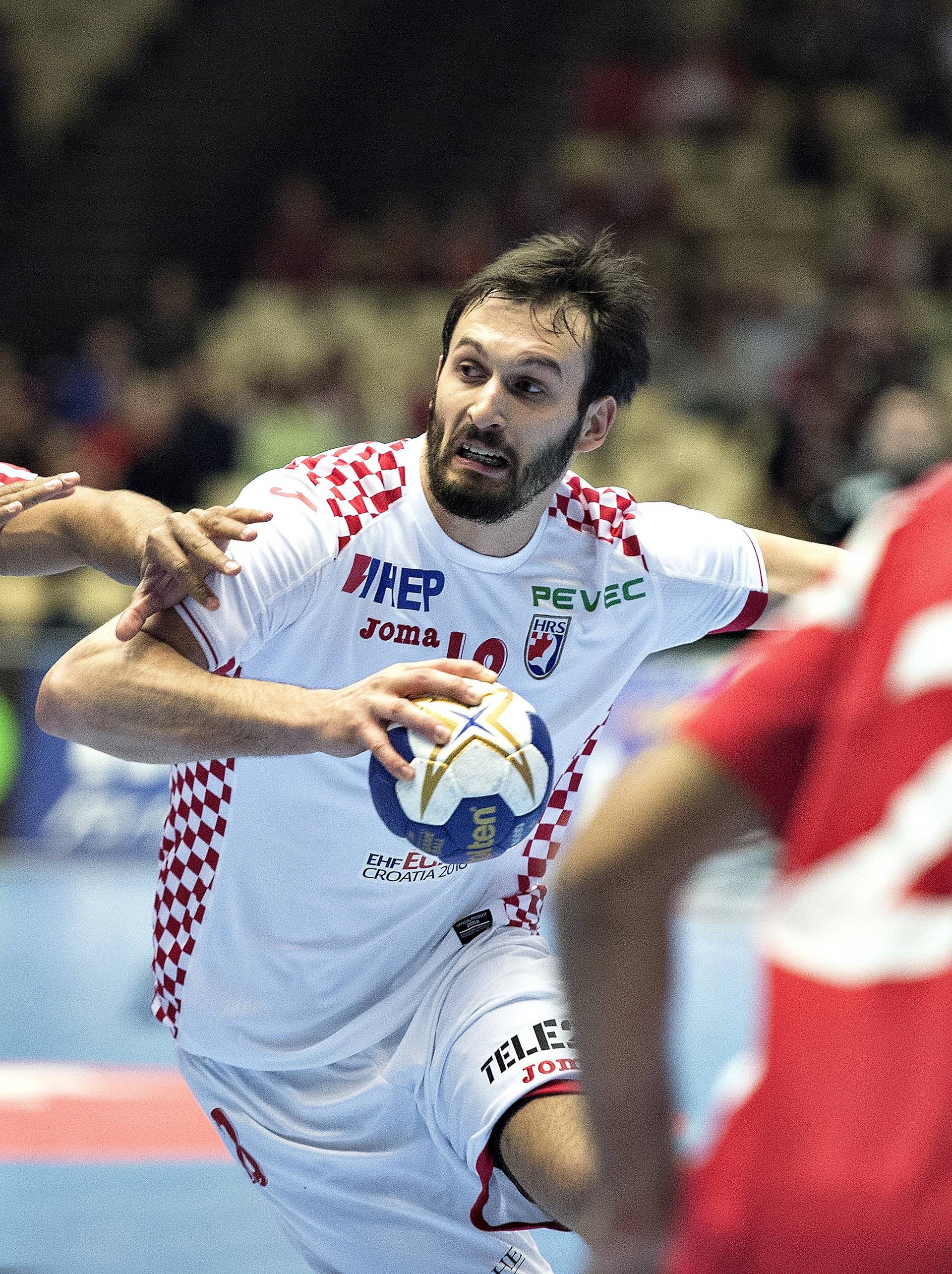 Habib Mohamed of Bahrain and Igor Karaci of Croatia in action during their men's handball Olympic qualification match in Boxen