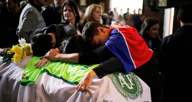 Relatives of Chapecoense soccer club head coach Caio Junior, who died in the plane crash in Colombia, participate in a ceremony to pay tribute to him in Curitiba
