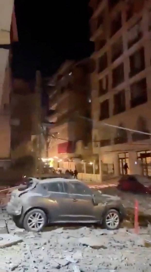 Debris from a damaged residential building, as Israel announced the launch of strikes on Lebanon, in Beirut