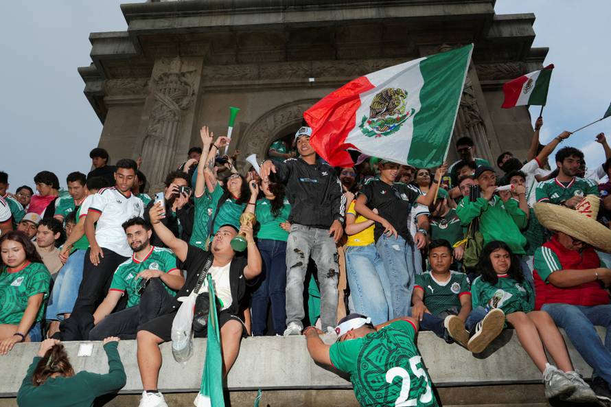 People celebrate Mexico's victory in the opening match of the 2026 FIFA World Cup, in Mexico City