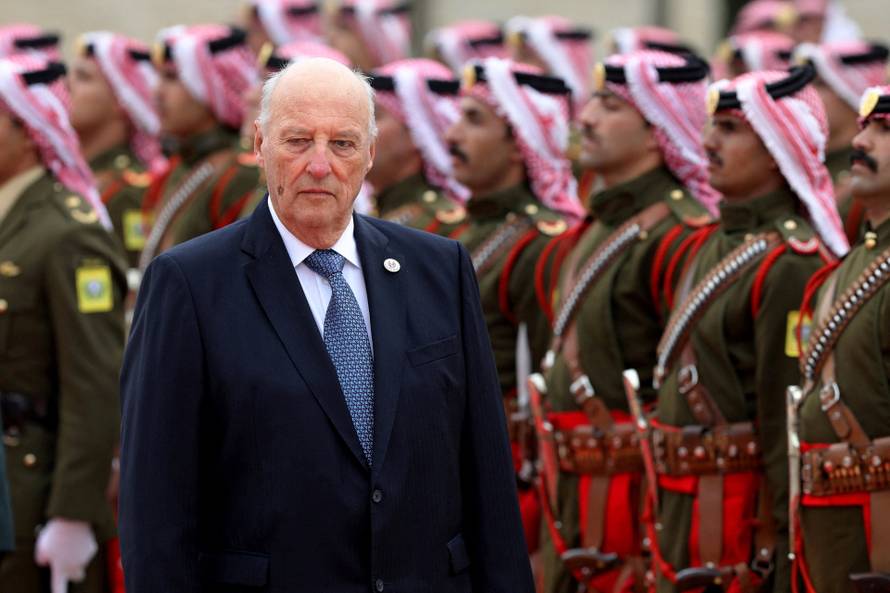 FILE PHOTO: Norway's King Harald V reviews an honor guard at the Royal Palace in Amman