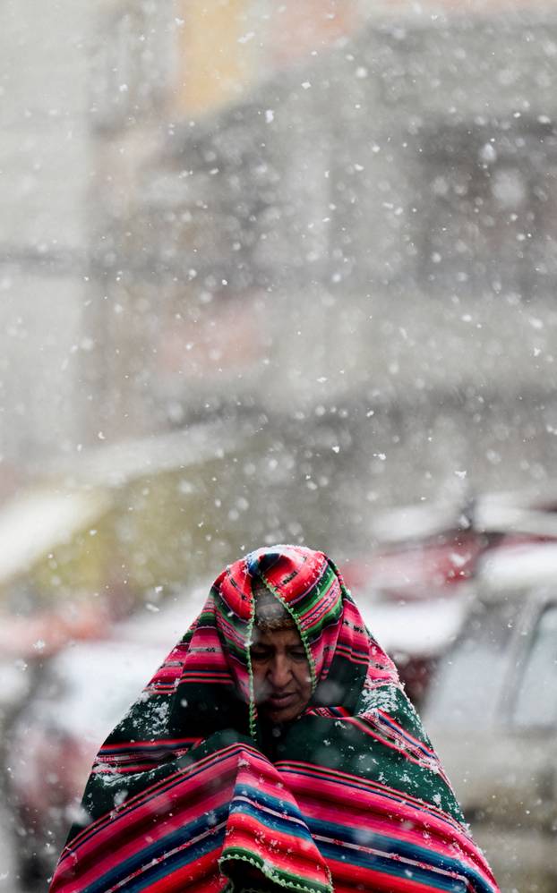 Snow falls amid low temperatures in Bolivia, in El Alto