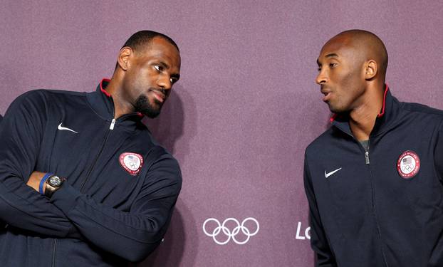 FILE PHOTO: U.S. basketball player Bryant talks teammate James at news conference before start of London 2012 Olympic Games