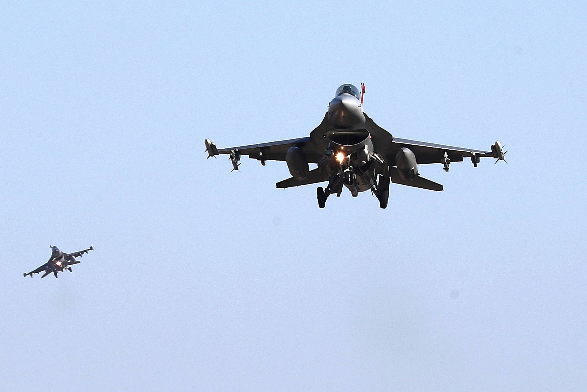 U.S. Air Force F-16 fighter jets fly over the Osan Air Base in Pyeongtaek