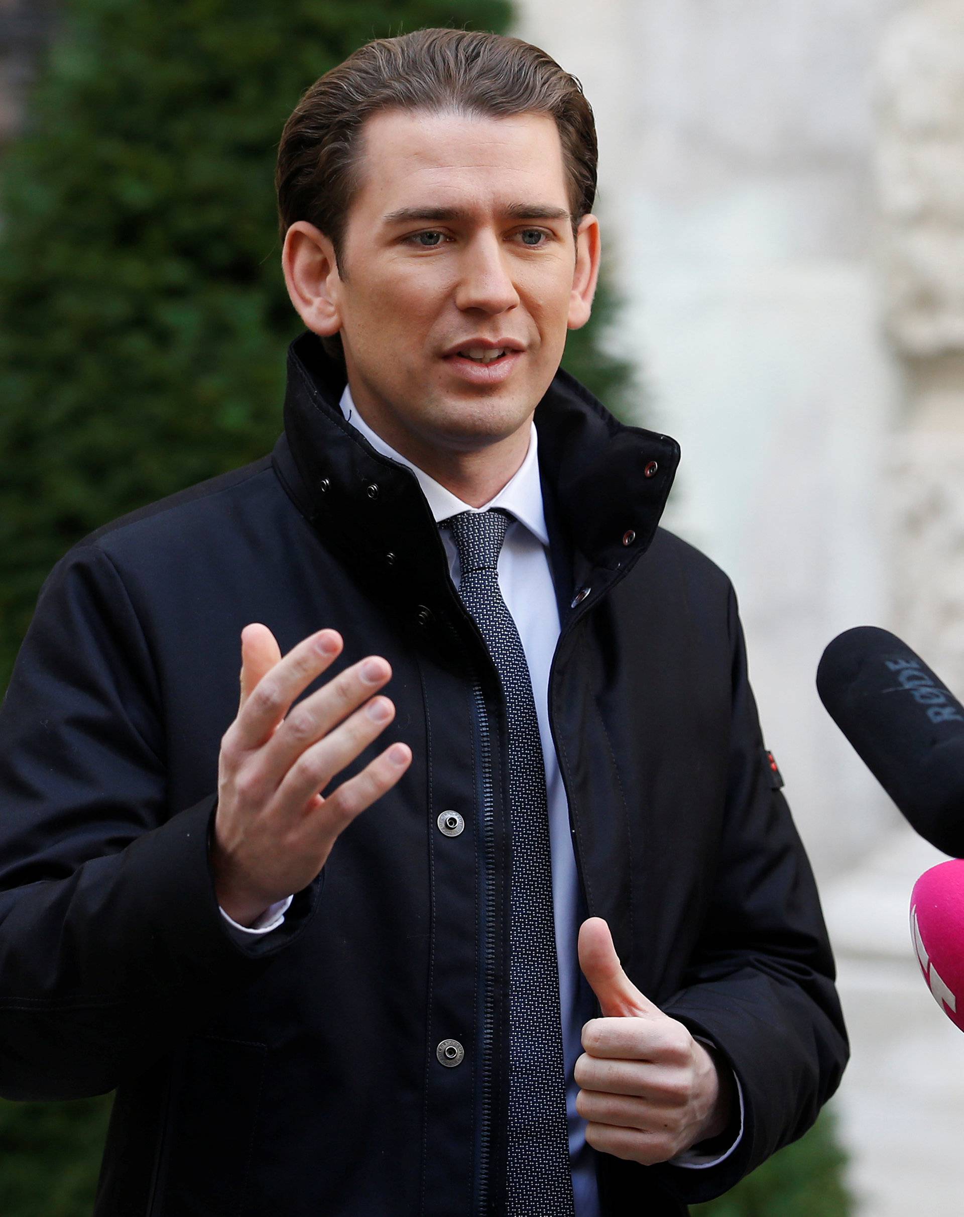 Head of the OeVP Sebastian Kurz addresses the media as he arrives for coalition talks in Vienna