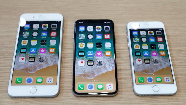 FILE PHOTO: Different iPhone 8 models are displayed during an Apple launch event in Cupertino