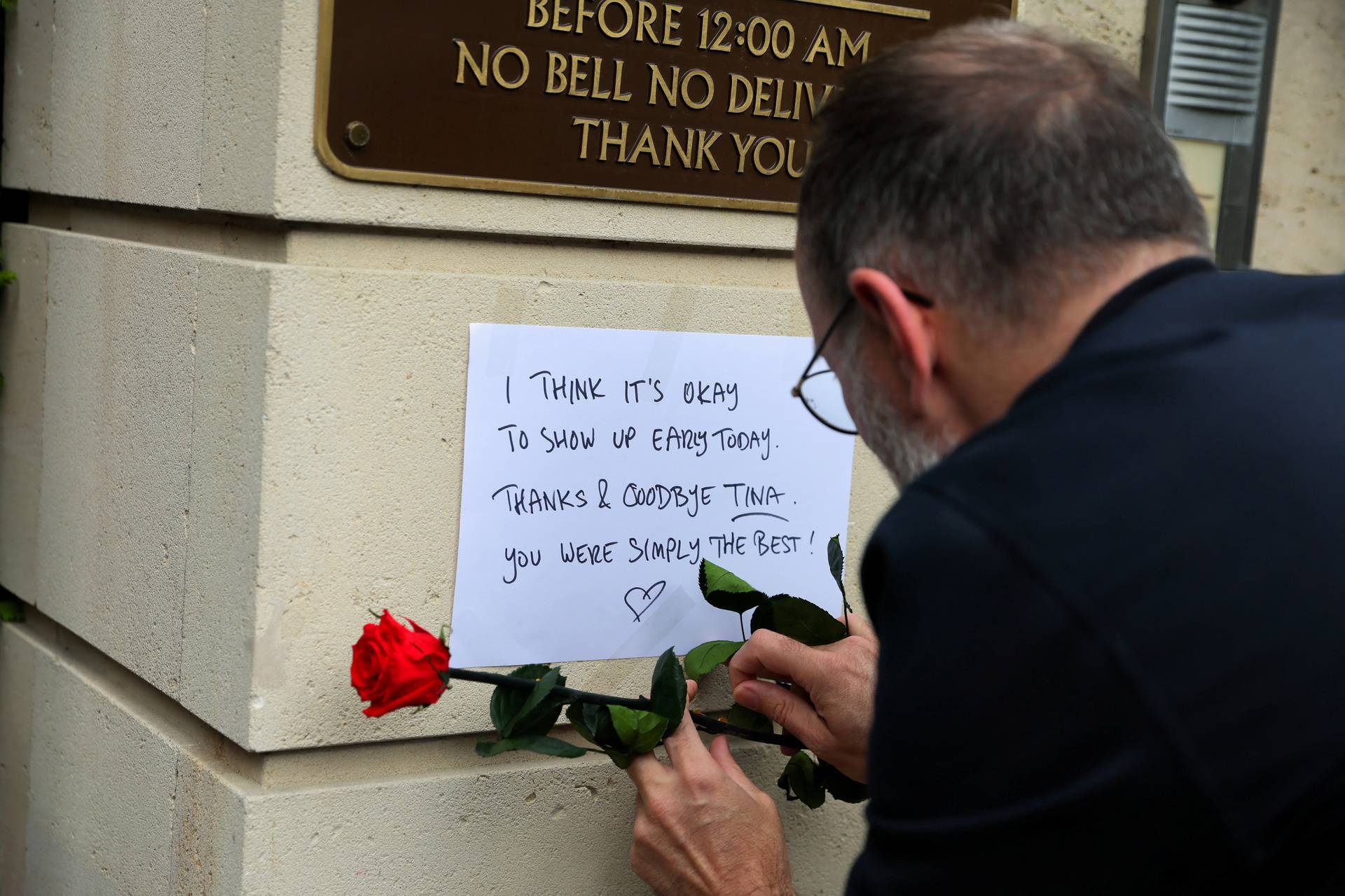 People lay flowers and candles in front of the home of late singer Tina Turner in Kuesnacht