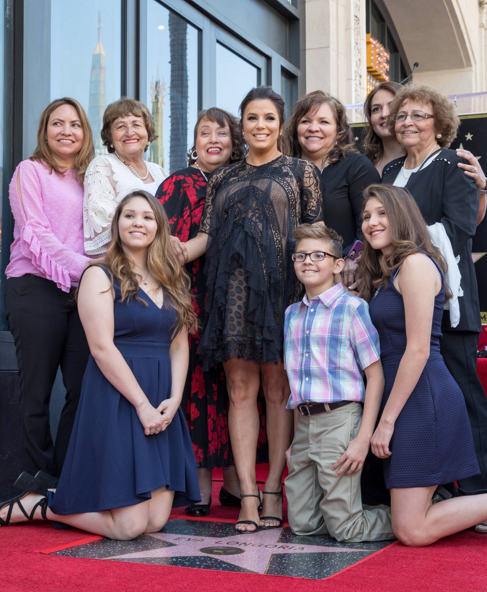 Eva Longoria poses with her family on the Hollywood Walk of Fame in Los Angeles