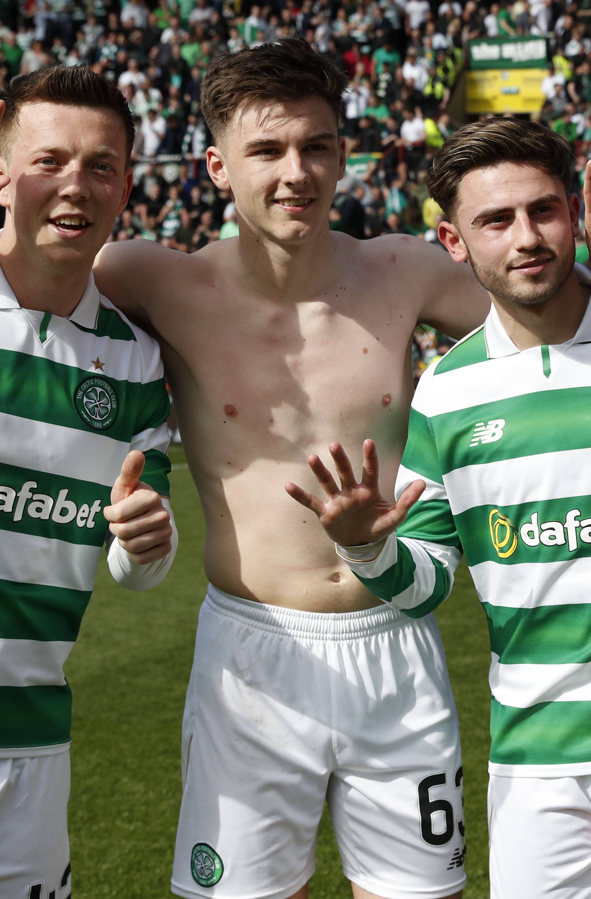 Celtic's Callum McGregor, Patrick Roberts and Kieran Tierney celebrate winning the Scottish Premiership