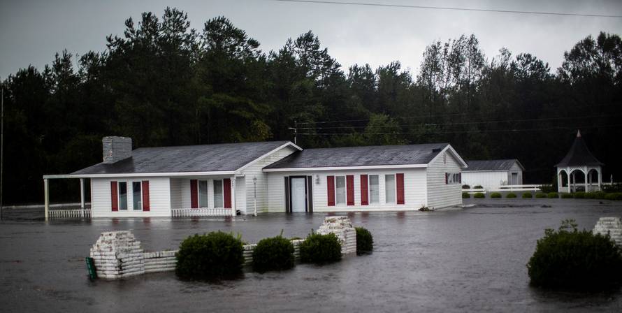 A house is seen flooded by rain after Hurricane Florence swept through the town of Wallace