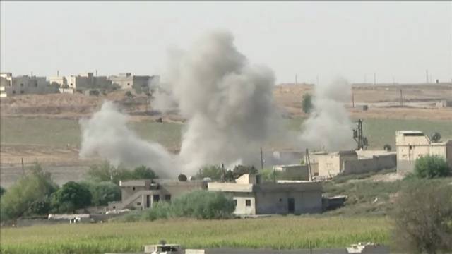 Smoke rises from an explosion during an offensive by Turkish-led forces in Tel Abyad