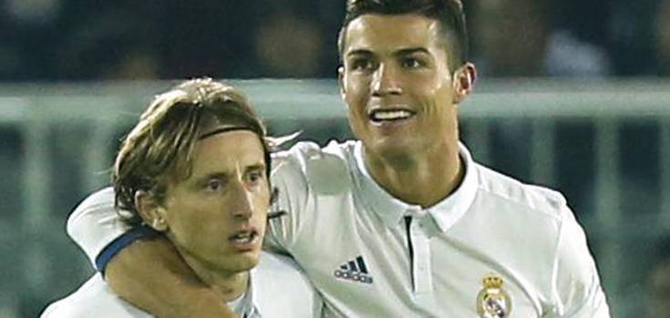 Real Madrid's Cristiano Ronaldo celebrates scoring their fourth goal with Luka Modric