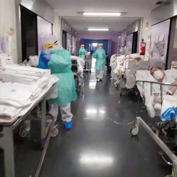 General view of a corridor with patients and medical personnel at an emergency unit of a Spanish hospital in Getafe, outside Madrid