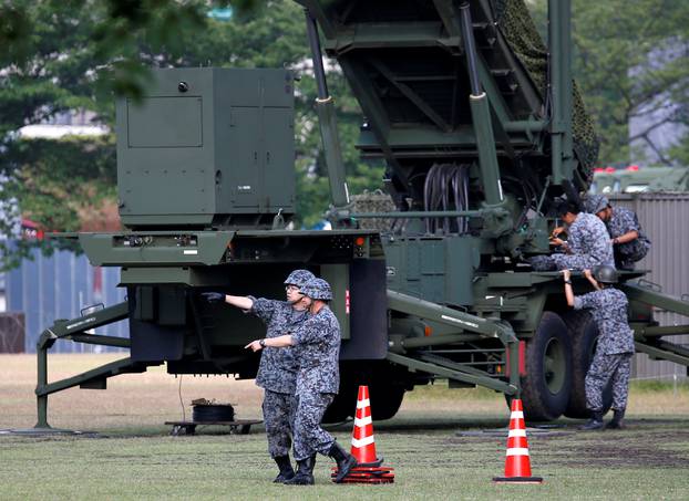 Japan Self-Defense Forces soldiers are seen next to unit of Patriot Advanced Capability-3 (PAC-3) missiles at the Defense Ministry in Tokyo, Japan