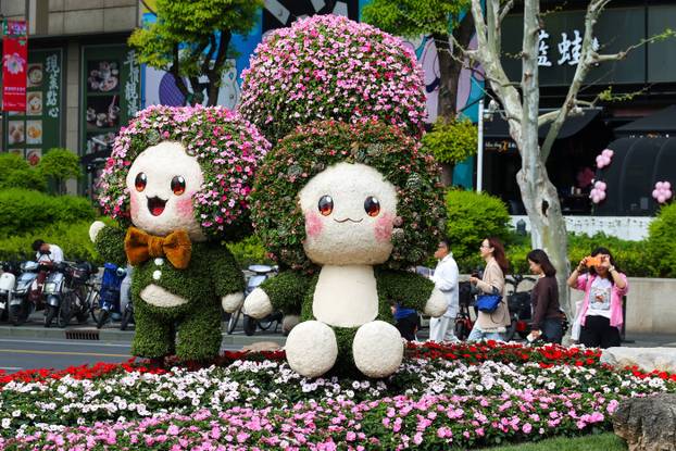 SHANGHAI, CHINA - APRIL 19: People visit a flower fair during the 2026 Shanghai International Flower Show at a park on A