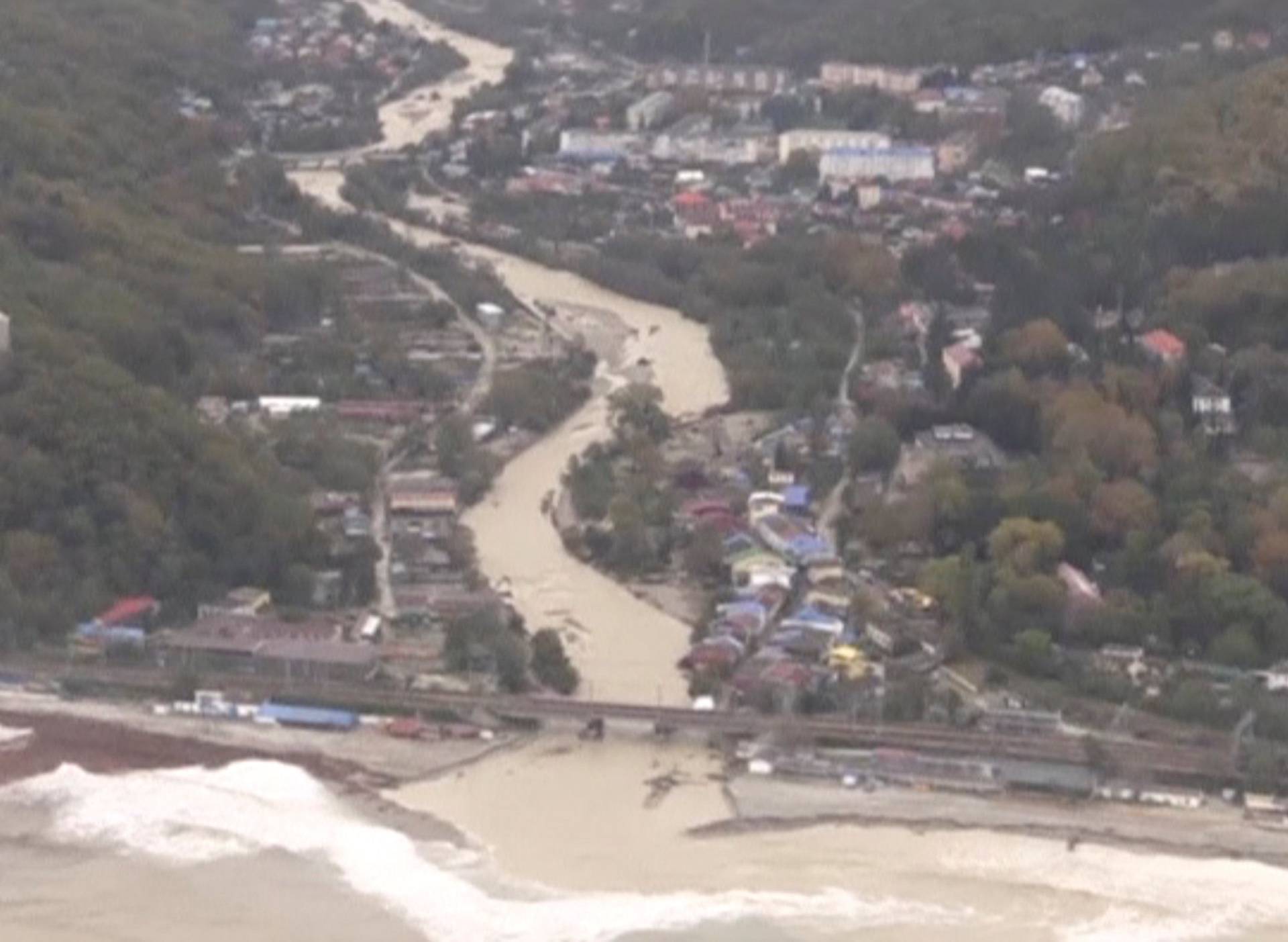 A still image shows a settlement affected by floodwaters in Krasnodar Region