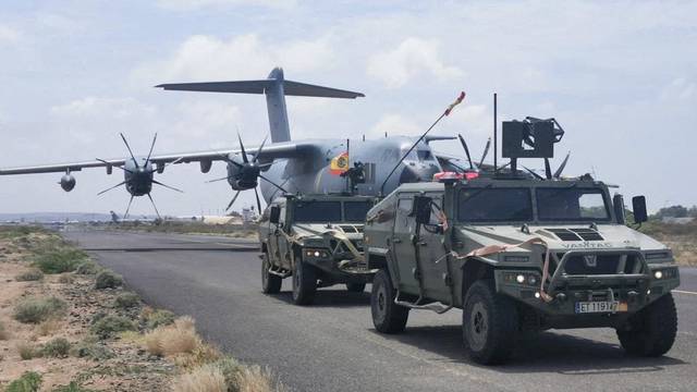 FILE PHOTO: Spanish military plane and military vehicles depart on tarmac as Spanish diplomatic personnel and citizens are evacuated, in Khartoum