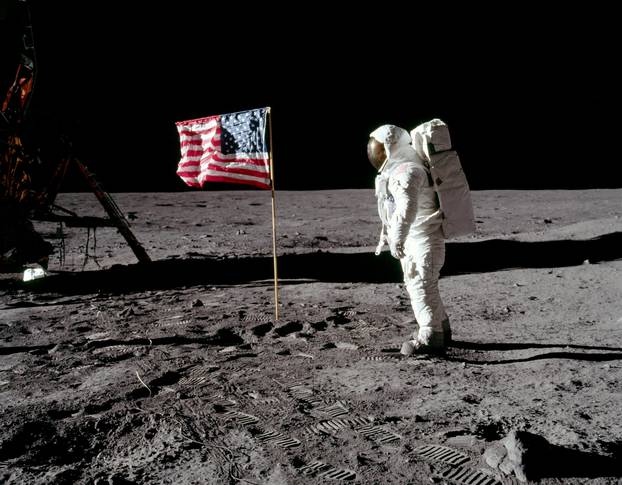 FILE PHOTO: Buzz Aldrin poses for a photograph beside the deployed United States flag on the moon