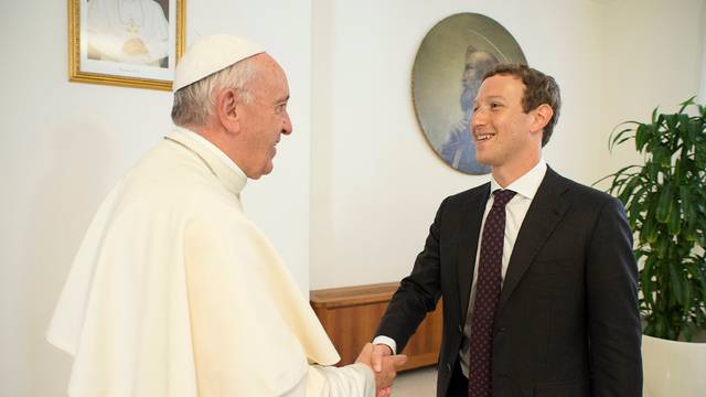 Pope Francis shakes hands with Facebook CEO Zuckerberg during a meeting at the Vatican 