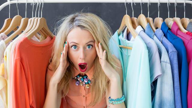 Stressed woman deciding what to wear