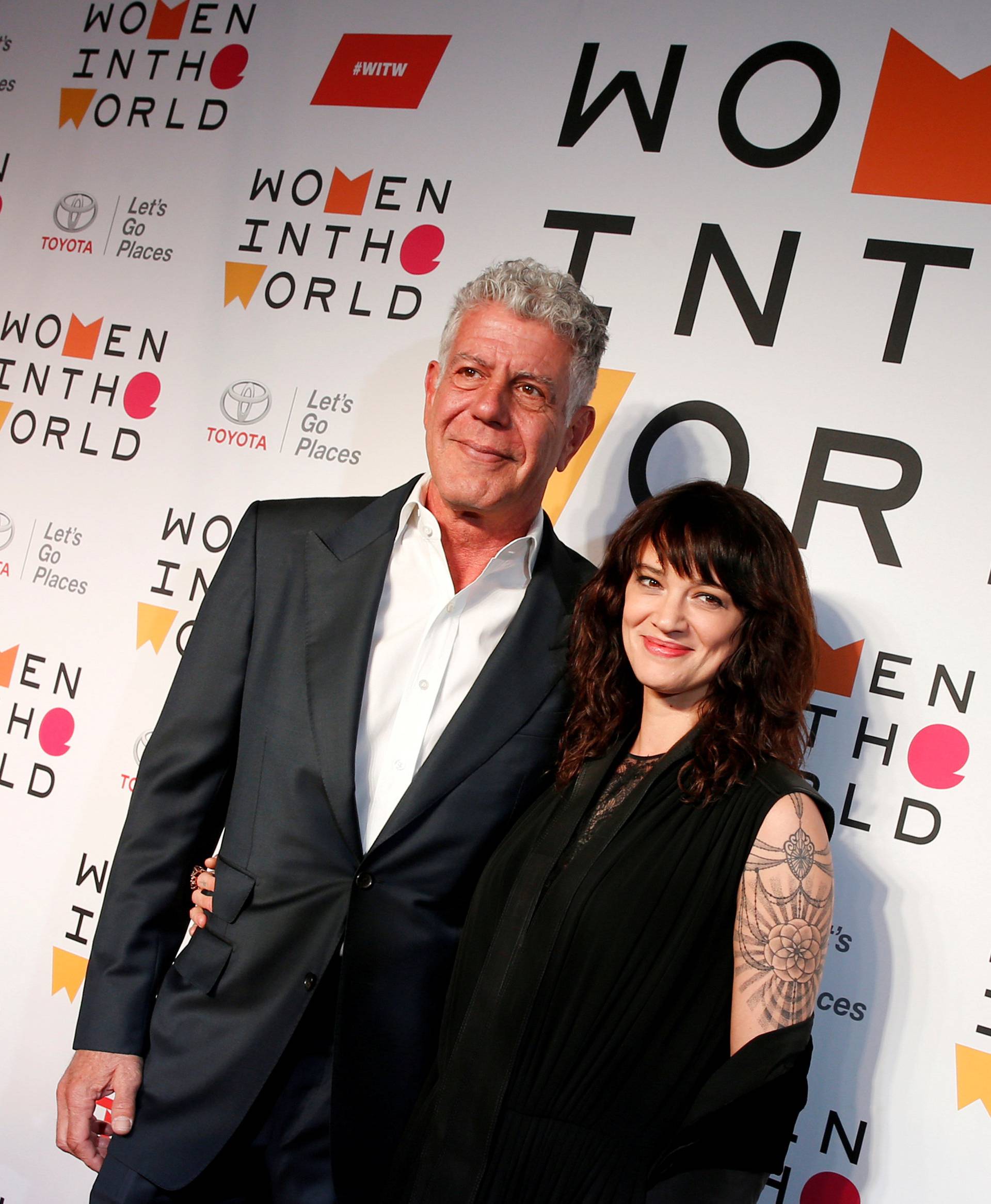 FILE PHOTO: Anthony Bourdain poses with Italian actor and director Asia Argento for the Women In The World Summit in New York