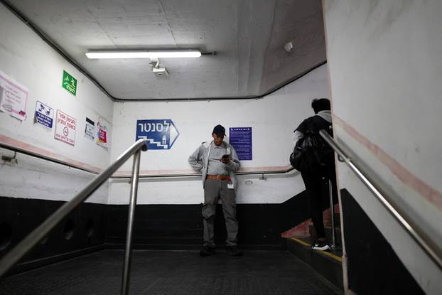 Israelis hold a Passover Seder in an underground parking garage used as a public bomb shelter, in Tel Aviv