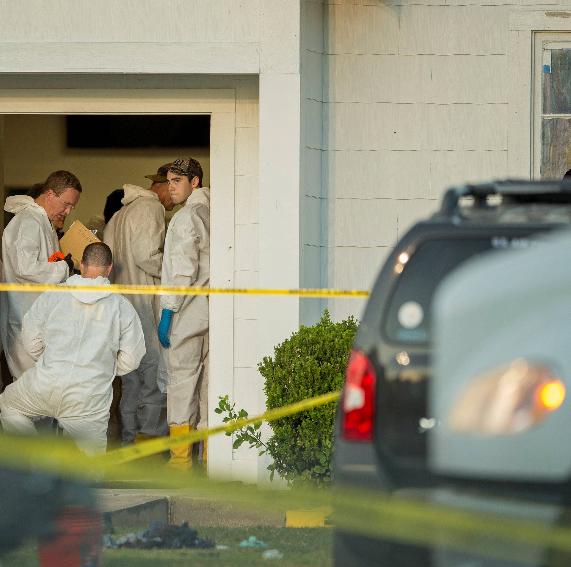 Law enforcement officials investigate a mass shooting at the First Baptist Church in Sutherland Springs