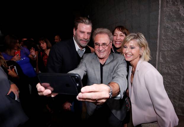 Cast members Travolta, Pearl, Conn and Newton-John pose for a selfie at a 40th anniversary screening of "Grease" at the Academy of Motion Picture Arts and Sciences in Beverly Hills